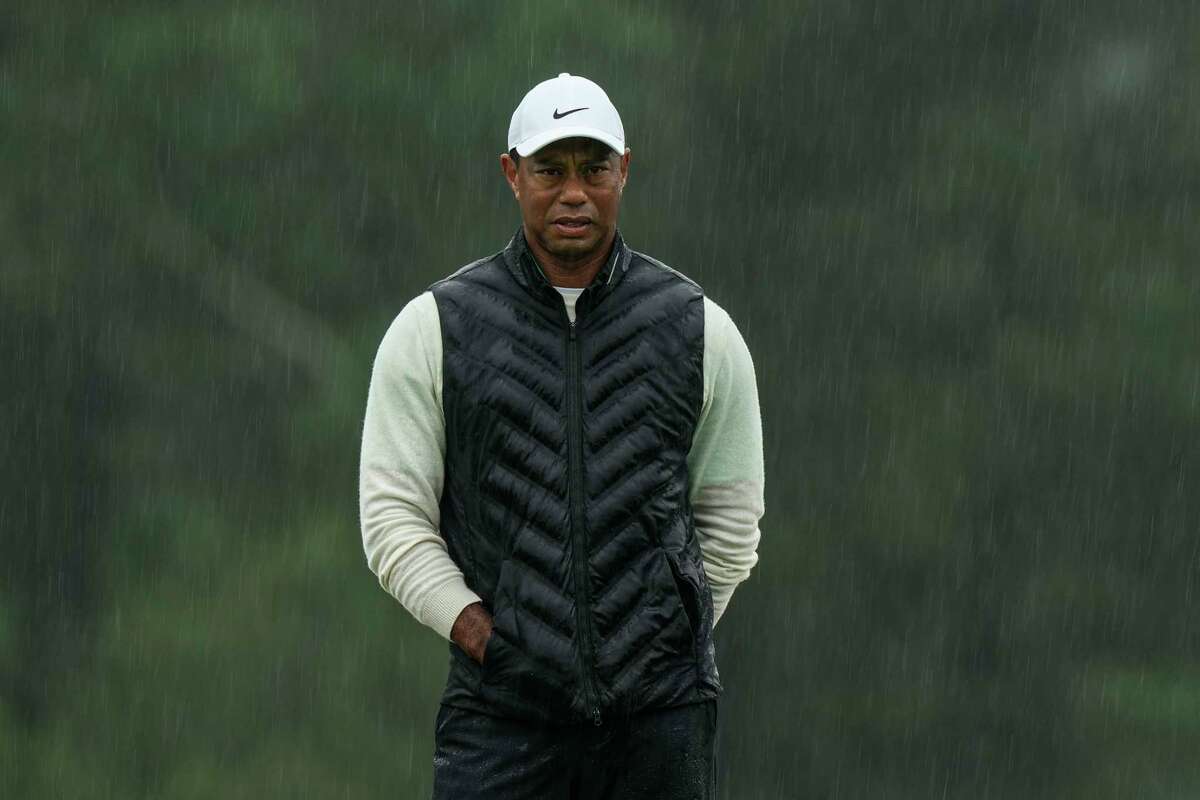 Tiger Woods walks on the 18th hole during the weather delayed second round of the Masters golf tournament at Augusta National Golf Club on Saturday, April 8, 2023, in Augusta, Ga.