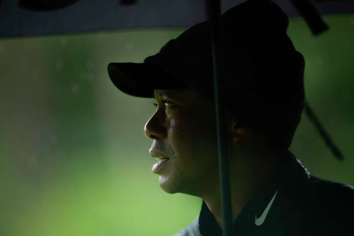 Tiger Woods watches on the 13th hole during the weather delayed third round of the Masters golf tournament at Augusta National Golf Club on Saturday, April 8, 2023, in Augusta, Ga.