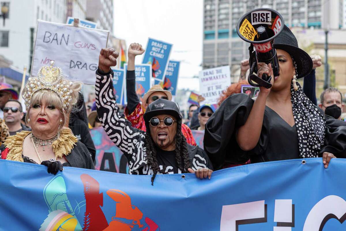 Nicole Murray Ramirez (left), Alex U. Inn and Honey Mahogany march to Union Square.