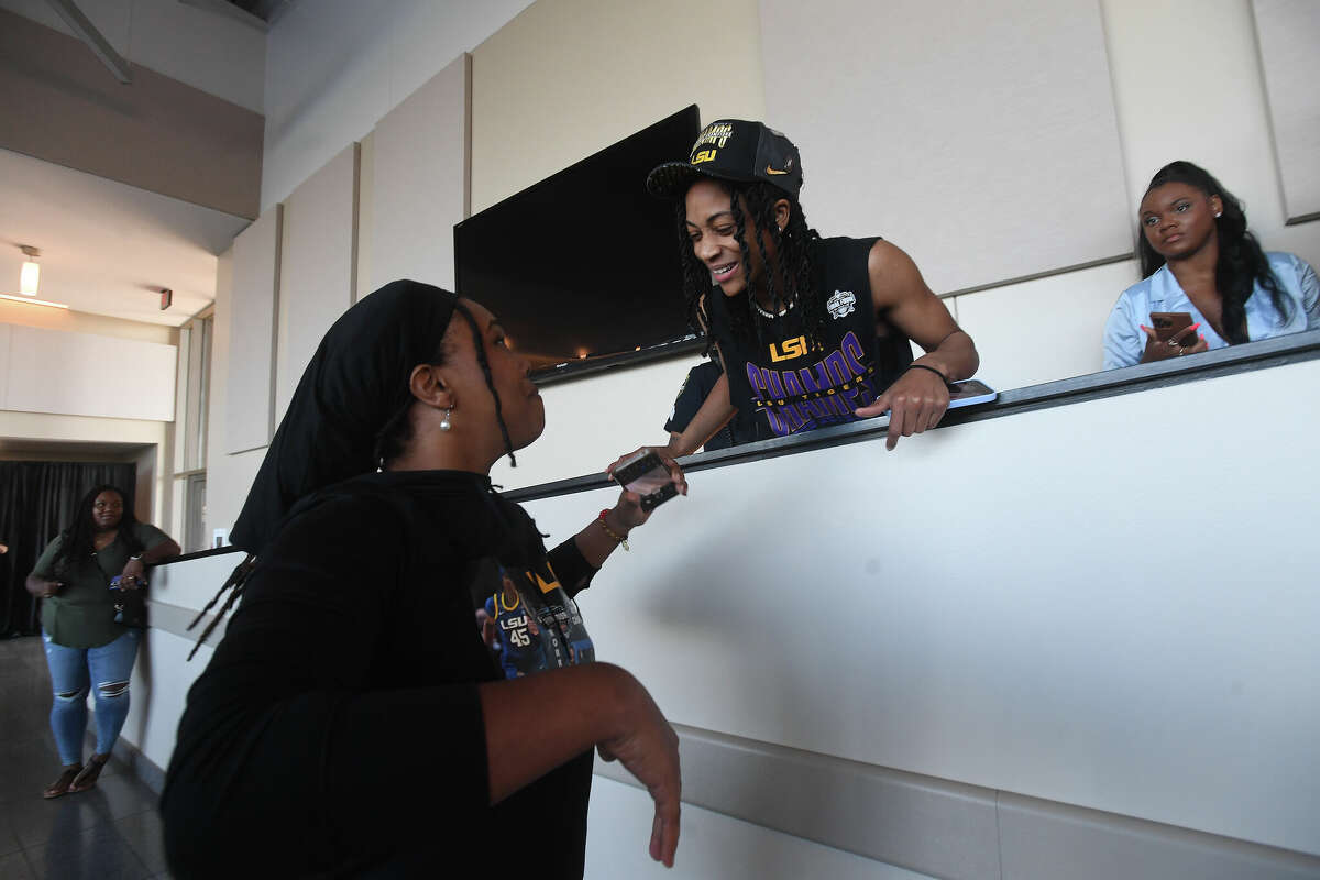 Alexis Morris talks with a friend after arriving for a community celebration of hometown basketball stars Alexis Morris and the Beaumont United Timberwolves. Photo made Saturday, April 8, 2023 Kim Brent/Beaumont Enterprise