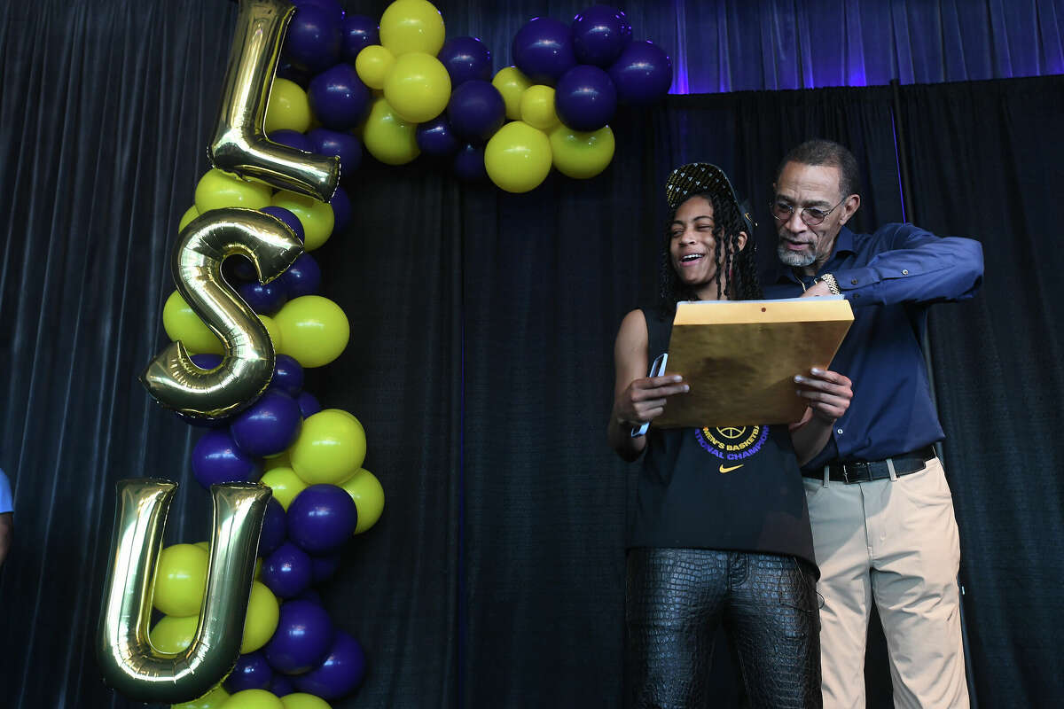 Alexis Morris reacts as councilman Audwin Samuel reads the proclamation during a community celebration of hometown basketball stars Alexis Morris and the Beaumont United Timberwolves. Photo made Saturday, April 8, 2023 Kim Brent/Beaumont Enterprise