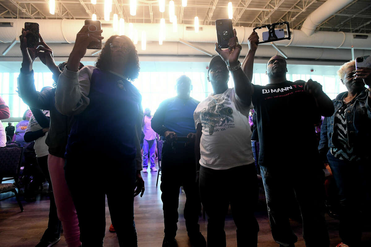 The crowd records the moment during a community celebration of hometown basketball stars Alexis Morris and the Beaumont United Timberwolves. Photo made Saturday, April 8, 2023 Kim Brent/Beaumont Enterprise
