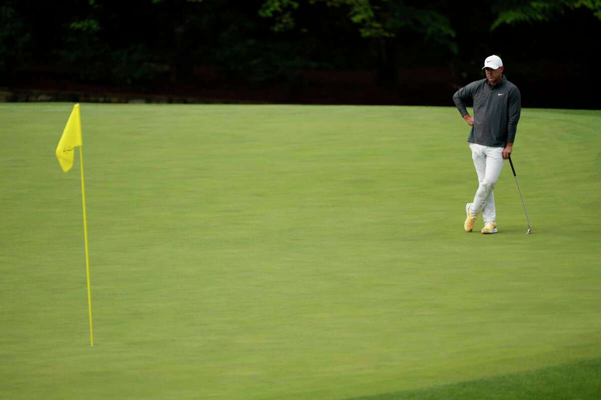 Brooks Koepka waits to putt on the 11th hole during the weather delayed third round of the Masters golf tournament at Augusta National Golf Club on Sunday, April 9, 2023, in Augusta, Ga.