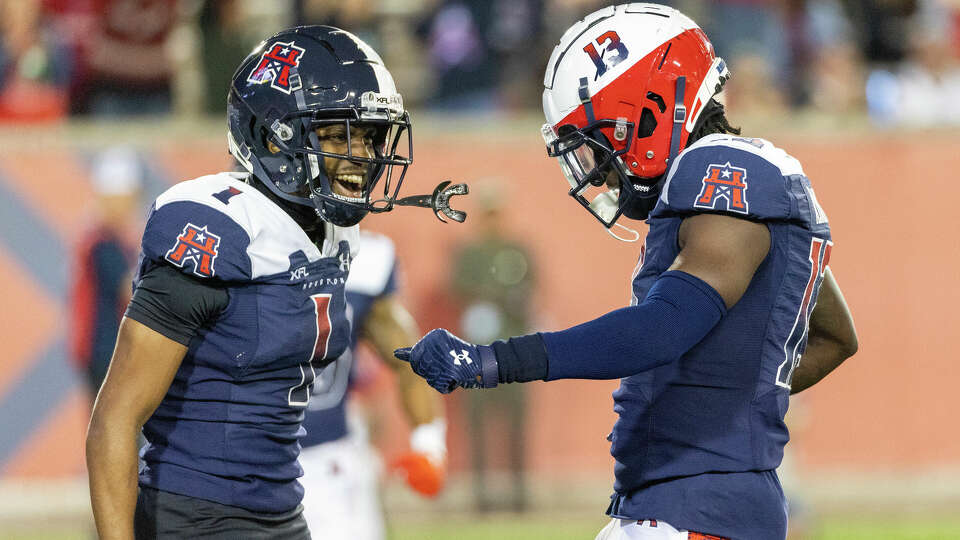 Houston Roughnecks wide receivers Deontay Burnett (1) celebrates Jontre Kirklin (13) touchdown reception against the San Antonio Brahmas in the first quarter of a XFL football game at TDECU Stadium on March 5, 2023 in Houston, TX.