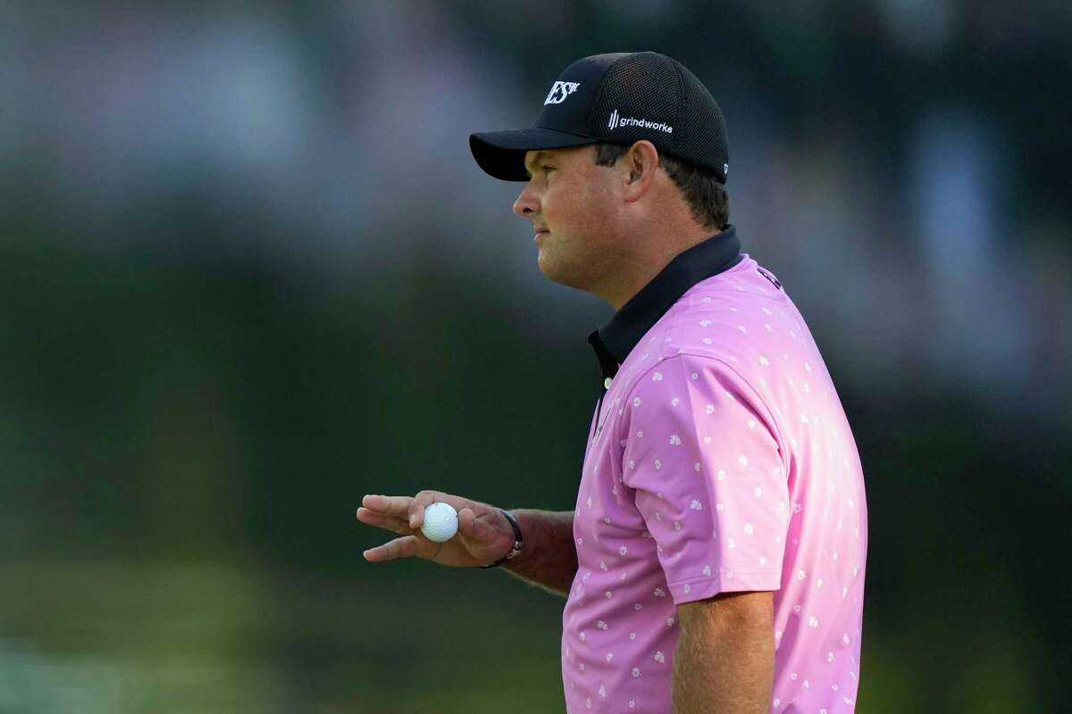 Patrick Reed waves after his putt on the 16th hole during the final round of the Masters golf tournament at Augusta National Golf Club on Sunday, April 9, 2023, in Augusta, Ga.