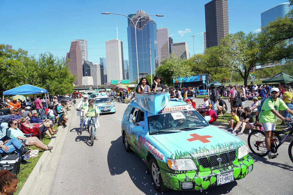 People celebrate during the annual Houston Art Car Parade in downtown Houston.