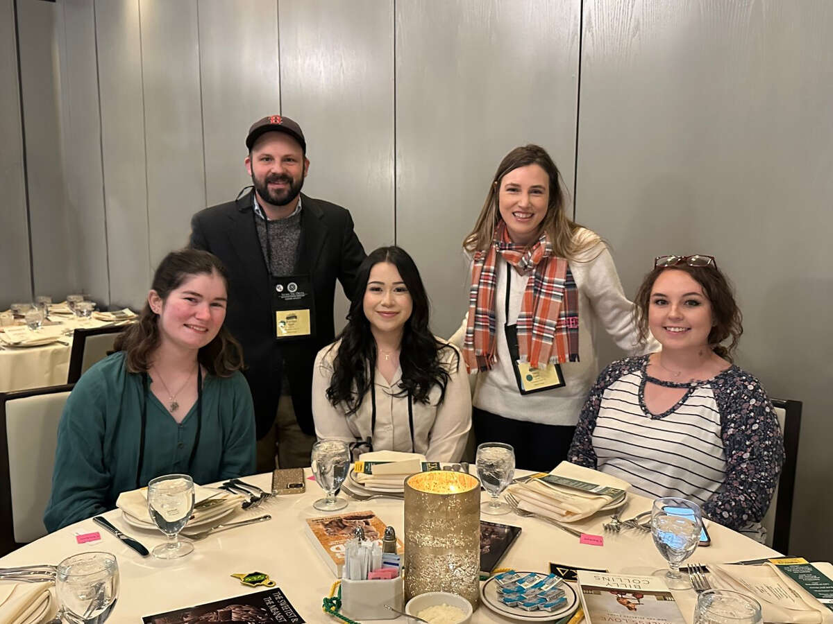 Midland College students and advisors at Sigma Tau Delta National Convention awards luncheon.  Front row, left to right, Abigail Hightower, Sadie Fuentes, and Brycie Tamayo. Back row, advisers Brendan and Stacy Egan.