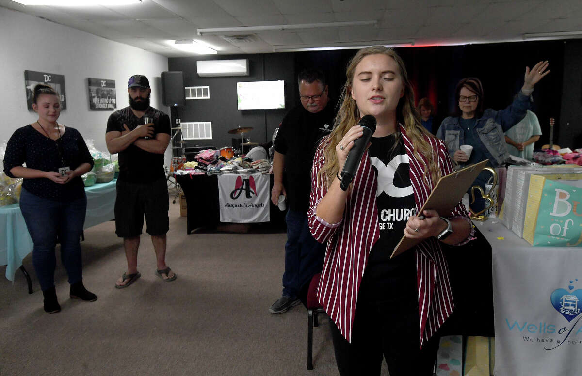 Nicole McKinney leads an opening prayer during the 2nd Annual Orange County Community Baby Shower at Destiny Church in Orange. Photo made Saturday, April 8, 2023 Kim Brent/Beaumont Enterprise