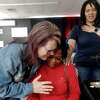 Donna Wells (left) and Tiffany Buckley with Wells of Agape, pray over Kimberly Wrighting, who is pregnant with her fifth child, during the 2nd Annual Orange County Community Baby Shower at Destiny Church in Orange. Photo made Saturday, April 8, 2023 Kim Brent/Beaumont Enterprise