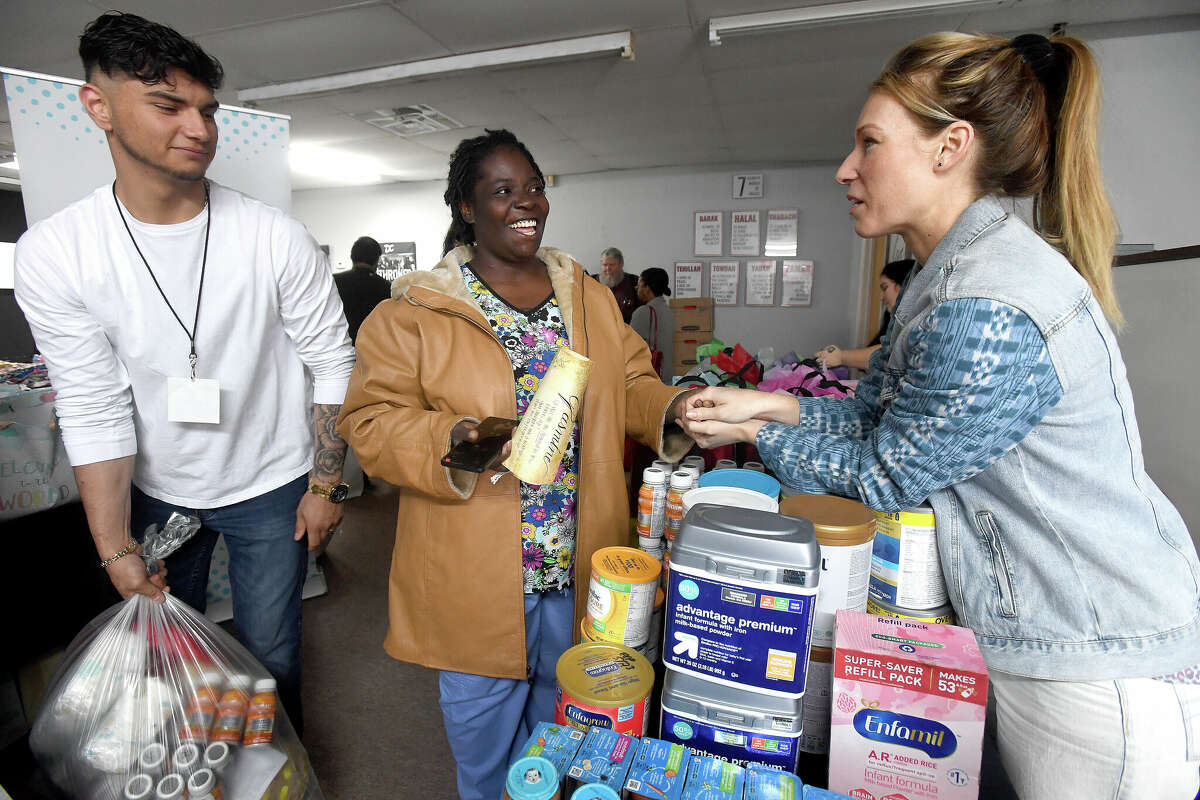 Heather Eggers offers words of inspiration and advice to Jasmine Gallow during the 2nd Annual Orange County Community Baby Shower at Destiny Church in Orange. Photo made Saturday, April 8, 2023 Kim Brent/Beaumont Enterprise