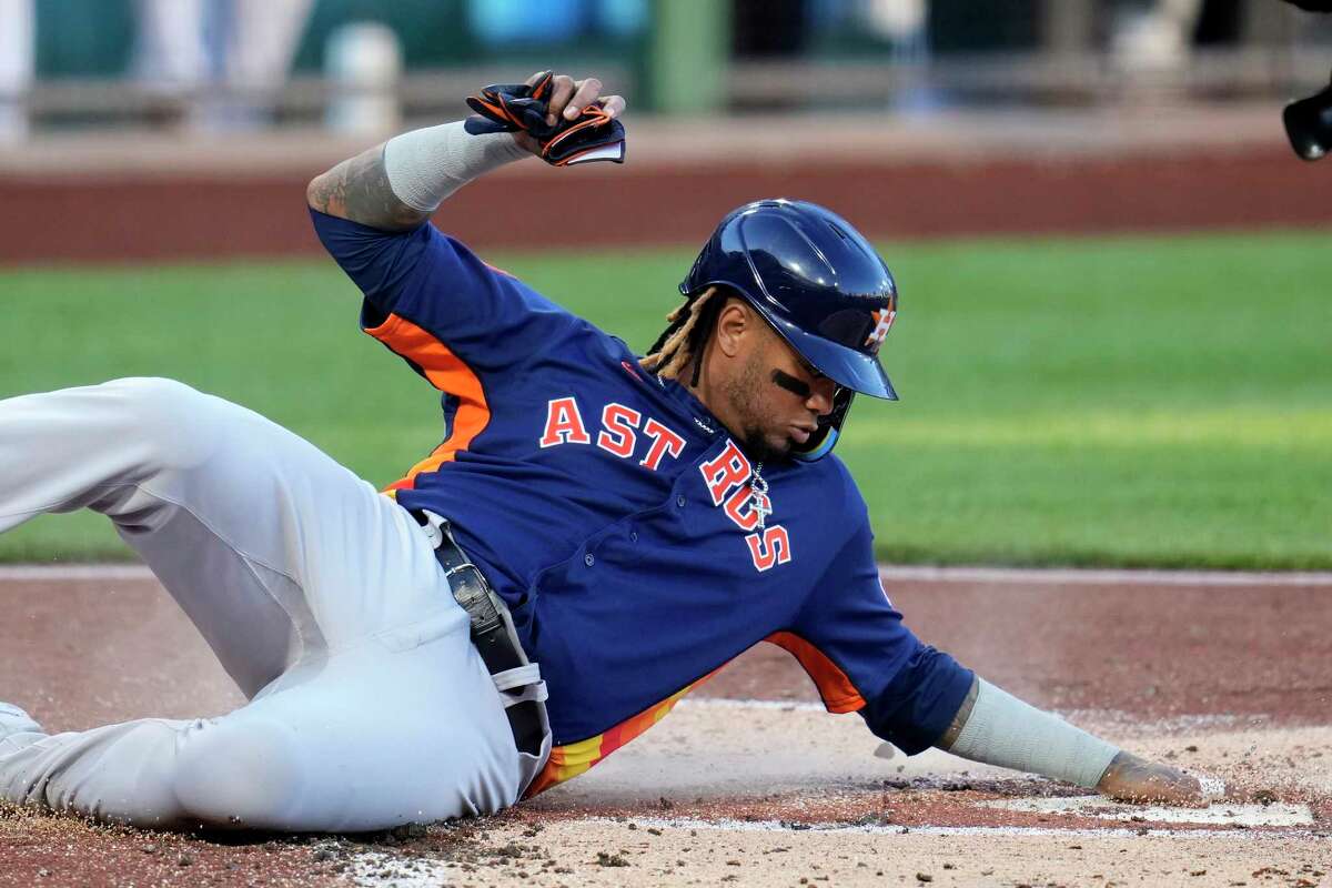 Houston Astros' Martin Maldonado scores the second of two runs on a single by Astros' Yordan Alvarez off Pittsburgh Pirates starting pitcher Roansy Contreras during the second inning of a baseball game in Pittsburgh, Monday, April 10, 2023.