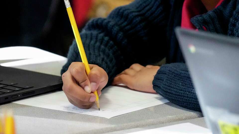 A student works on a lesson in a third grade class at Highland Heights Elementary on Tuesday, April 11, 2023 in Houston.