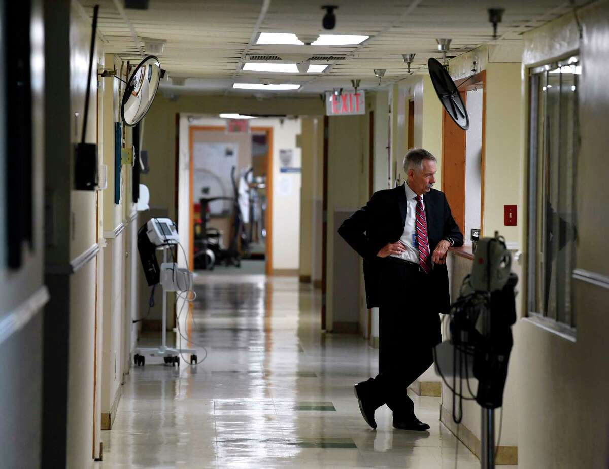 Ted Matthews, CEO of Anson General Hospital in Anson chats with nurses at their station Monday, April 10, 2023.