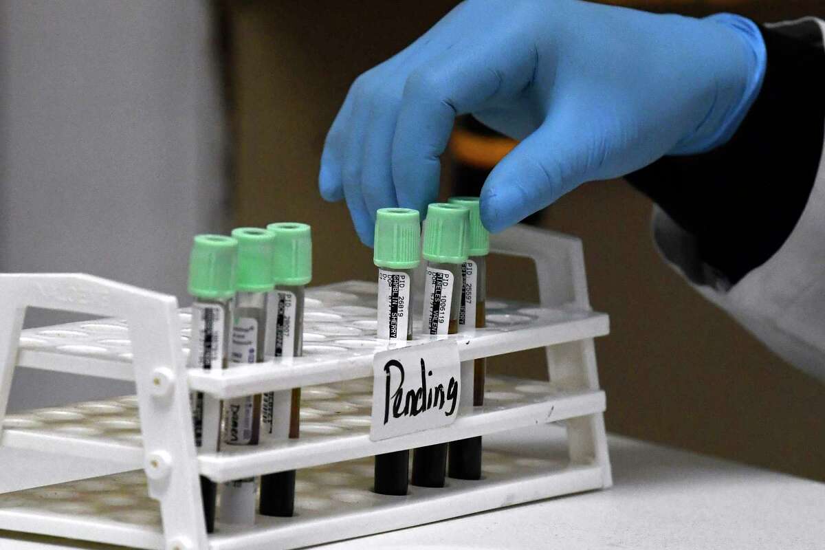 Albert Anorue, a medical lab technician at Anson General Hospital, organizes vials of blood after analysis Monday, April 10, 2023. He is one of two technicians at the Anson facility.