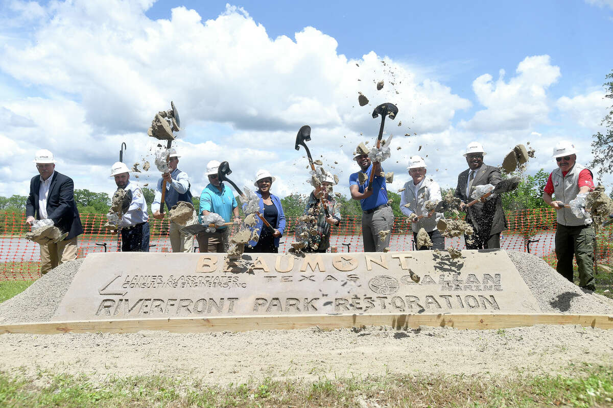 City council members and other, including Mayor Robin Mouton and former Mayor Becky Ames, toss the dirt during a groundbreaking ceremony to kick off the Riverfront Park restoration project. Photo made Tuesday, April 11, 2023 Kim Brent/Beaumont Enterprise