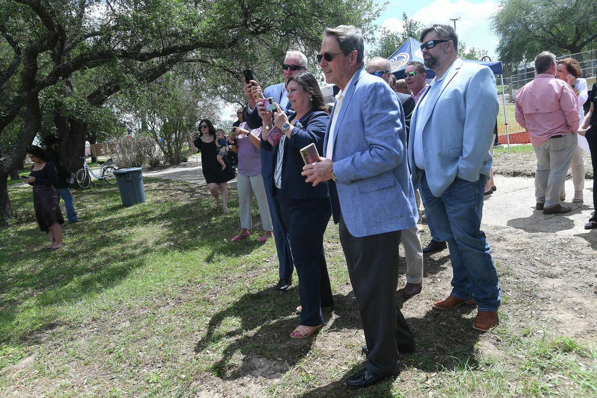 Attendees take more photos after dthe groundbreaking ceremony to kick off the Riverfront Park restoration project. Photo made Tuesday, April 11, 2023 Kim Brent/Beaumont Enterprise
