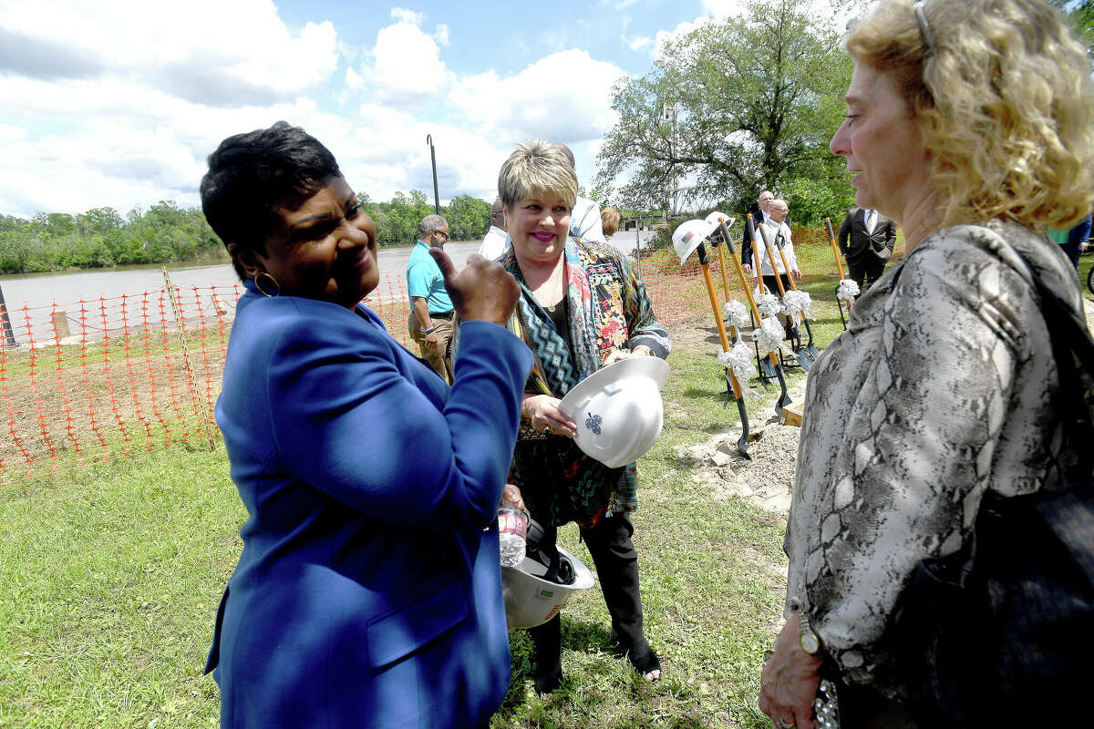Mayor Robin Mouton jokes with her predecessor Becky Ames after a groundbreaking ceremony to kick off the Riverfront Park restoration project. Photo made Tuesday, April 11, 2023 Kim Brent/Beaumont Enterprise