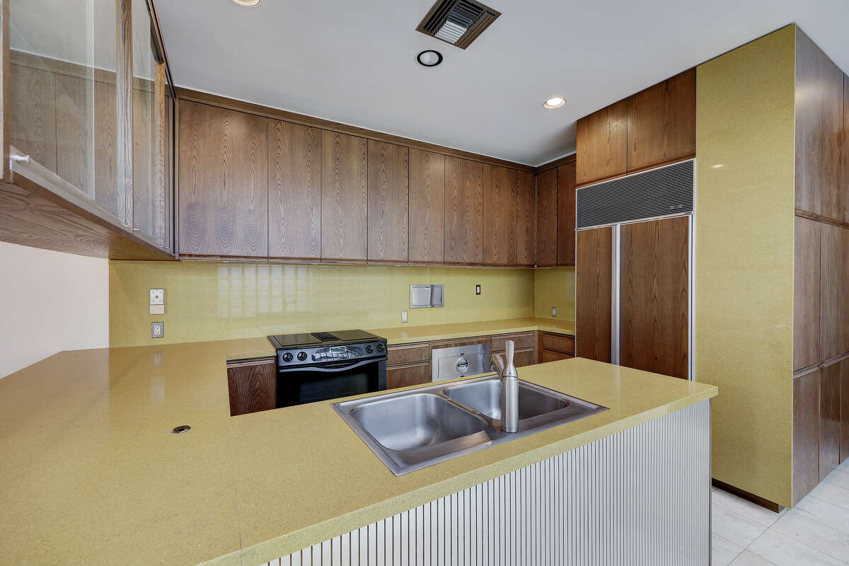 The yellow silestone kitchen countertops were imported from Spain.