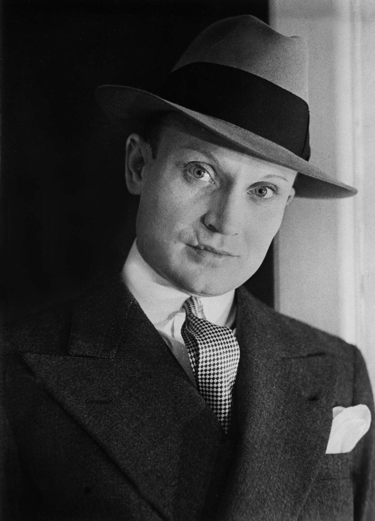 Portrait of Vander Clyde Broadway in a men's suit with a powdered face, 1932.