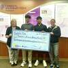 West Brook students Zain Sayyed, center left, and Raj Patel, center right, donate more than $2,100 to Children's Miracle Network Hospitals at Christus Southeast Texas, April 12, 2023.