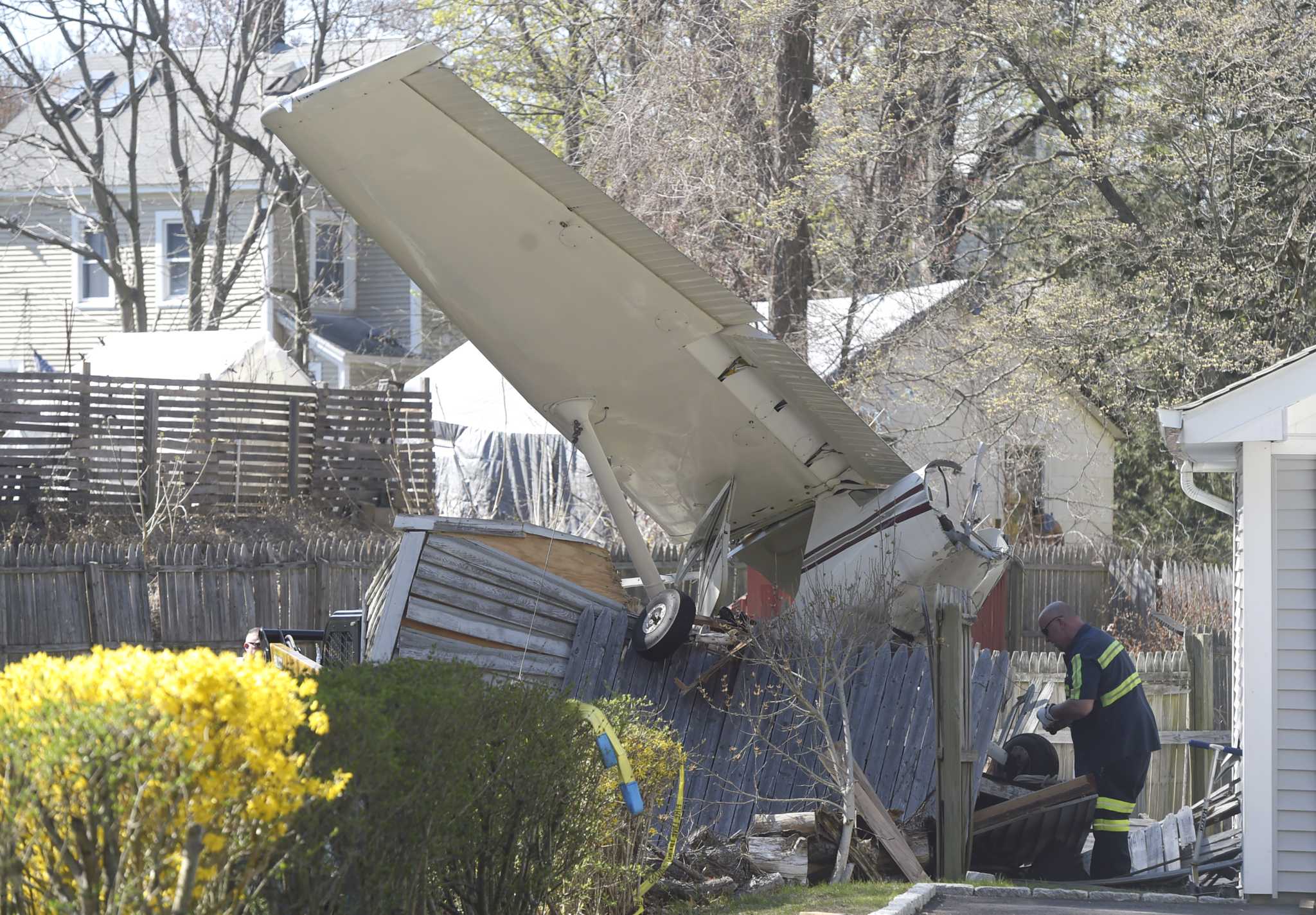 Plane that crashed into Danbury family's shed is sawed, removed