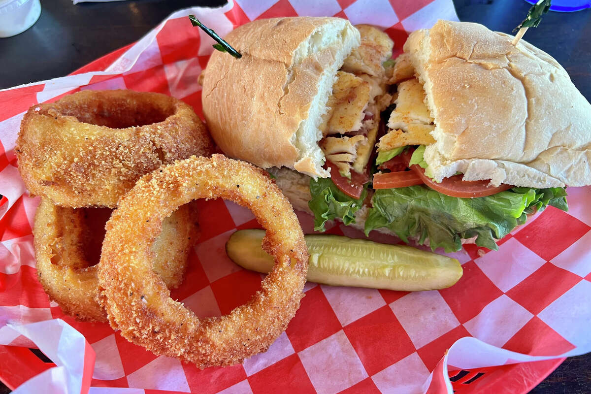 Fresh grilled fish sandwich and onion rings.