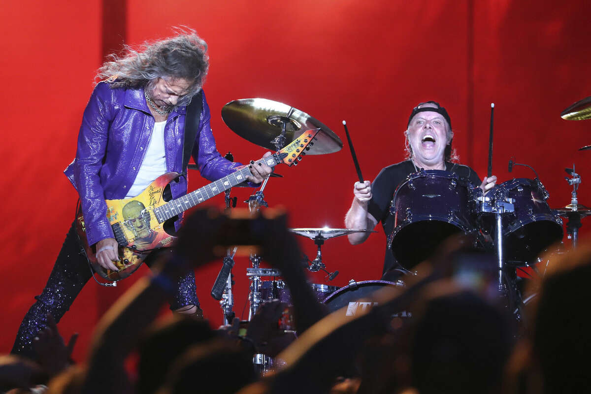 Metallica guitarist Kirk Hammett, left, and drummer Lars Ulrich perform at the Lollapalooza music festival in Chicago's Grant Park on July 28, 2022.  