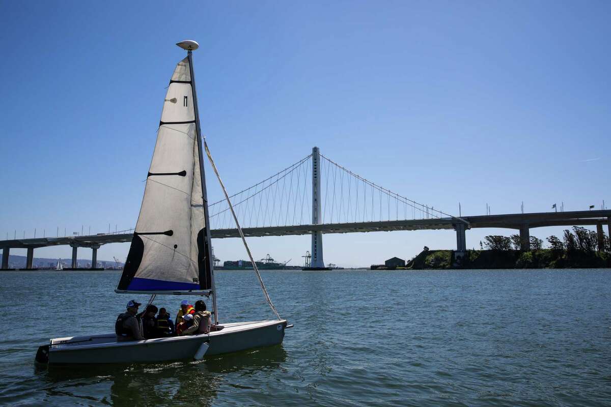 Folks ride on a sailboat from the Treasure Island Sailing Center to mark National Safe Boating Week