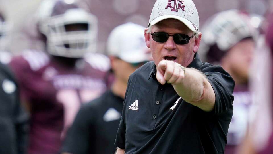 Texas A&M offensive coordinator Bobby Petrino yells to the a player during warms up before the start of the annual Maroon & White football game in College Station, Saturday, April 15, 2023.