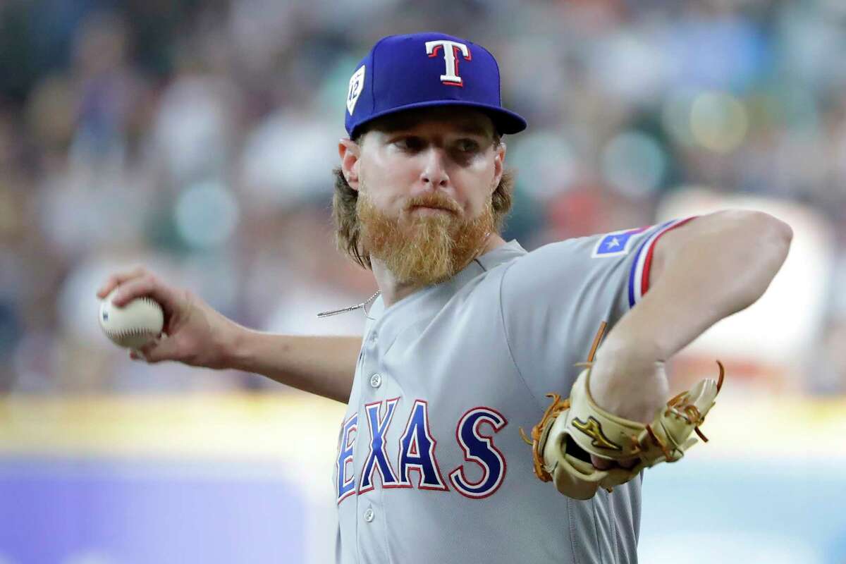Texas Rangers starting pitcher Jon Gray throws to a Houston Astros batter during the first inning of a baseball game Saturday, April 15, 2023, in Houston.