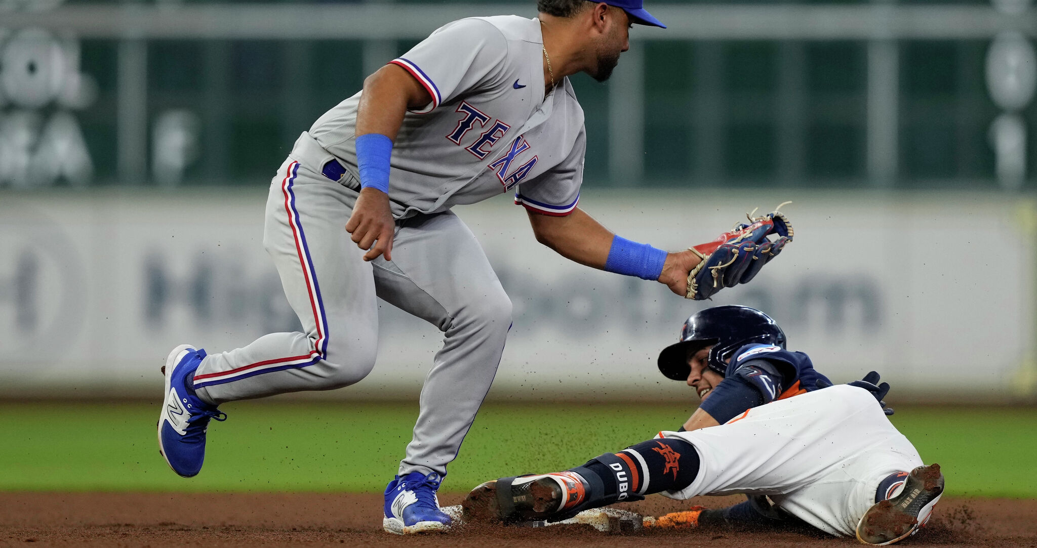Mauricio Dubon of the World Team slides safely into third base during  News Photo - Getty Images