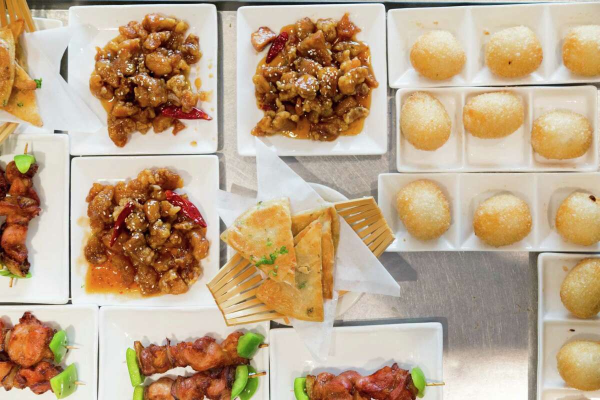 Sesame chicken, BBQ pork puffs, and potato pancakes on a dim sum cart at City View restaurant during brunch in San Francisco, Calif., The restaurant is now open at a new location in Chinatown.