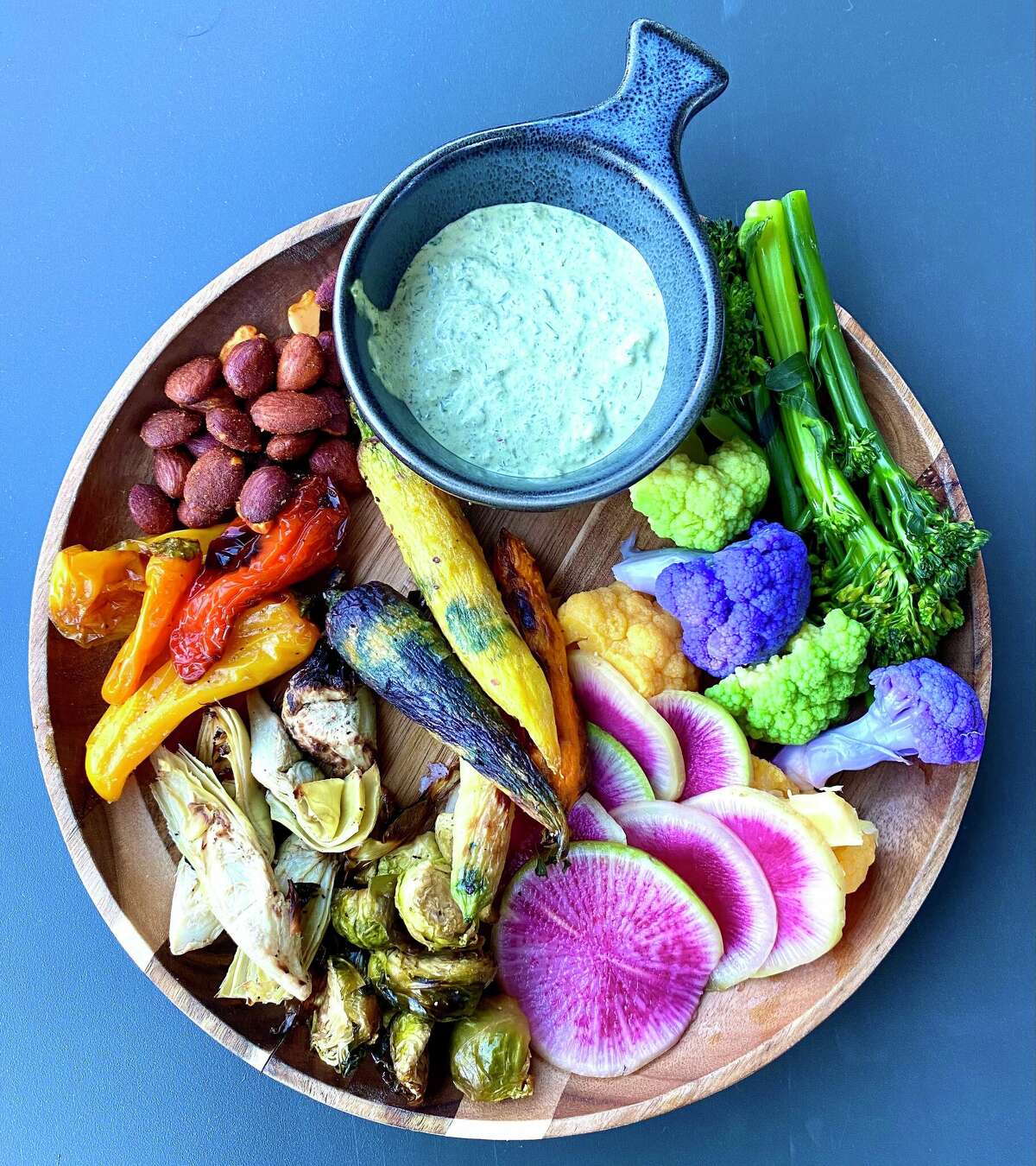 The Bounty, a tray full of vegetables, almonds and hummus is a favorite to share at Postino, a restaurant in Uptown Park in Houston.