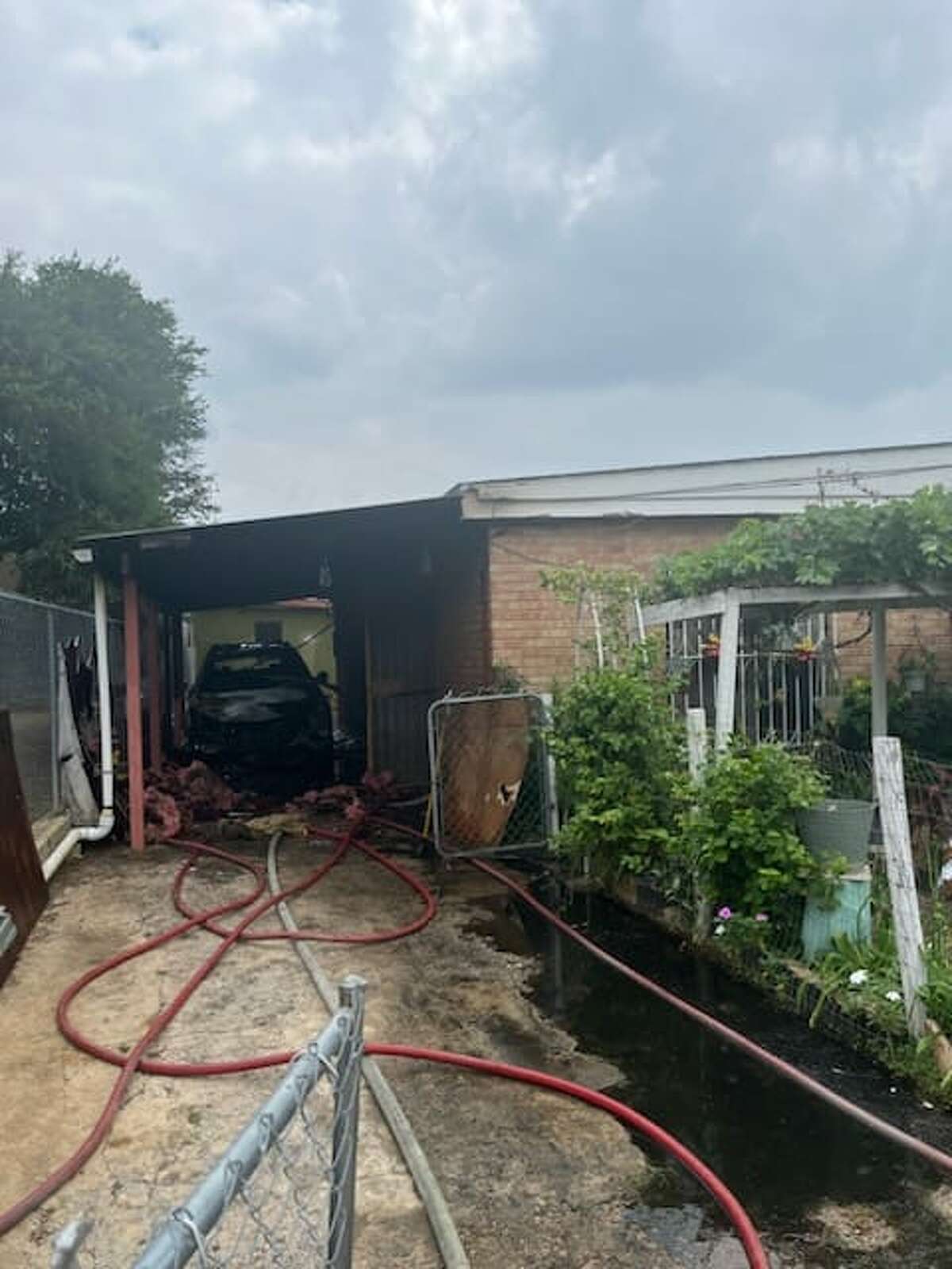 A north Laredo home saw a vehicle catch fire underneath a carport in the 900 block of Locust Street on Thursday, April 20, 2023.