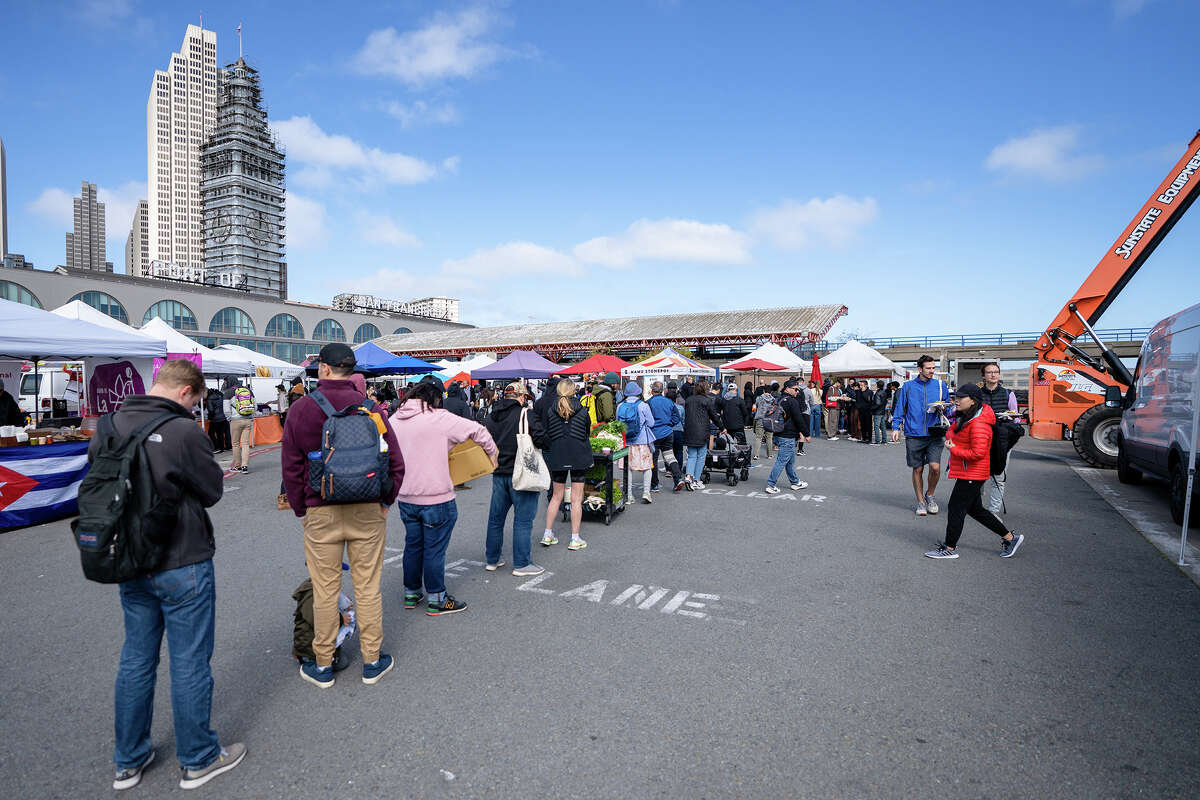 A long line forms at the Primavera stall at the Ferry Plaza Farmers Market on Saturday, April 15, 2023.