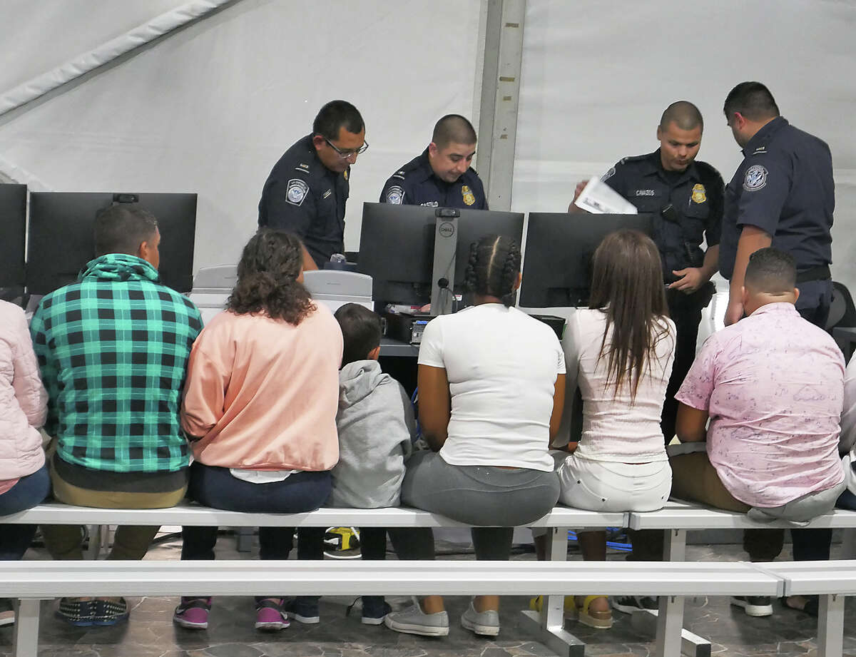 CBP officers identify and process immigrants who are seeking entrance into the United States on Sept. 17, 2019.
