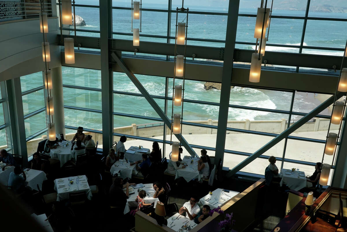 Diners eat at the Cliff House in 2019.  A new, unannounced restaurant will take its place.