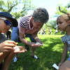 Hudson and sister Karrington Aucoin and their grandmother Dona Vincent release their painted lady butterflies during the annual Eco-Fest celebration at Shangri La Botanical Gardens and Nature Center Saturday. Photo made Saturday, April 22, 2023 Kim Brent/Beaumont Enterprise
