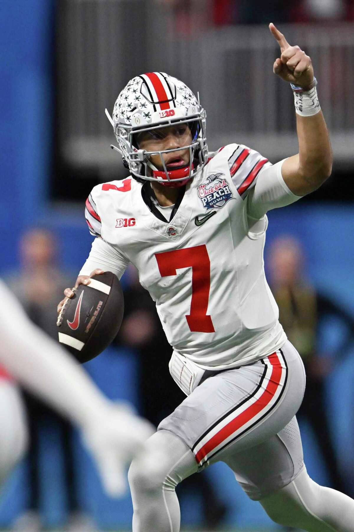 FILE - Ohio State quarterback C.J. Stroud (7) signals to Ohio State wide receiver Marvin Harrison Jr. (18) before throwing a pass during the first half of the Peach Bowl NCAA college football semifinal playoff game against Georgia, Saturday, Dec. 31, 2022, in Atlanta. Harrison Jr. made the catch for a touchdown on the play. Bryce Young, C.J. Stroud, Anthony Richardson and Will Levis are projected to go anywhere from the top 5 to top 15 picks in this draft.