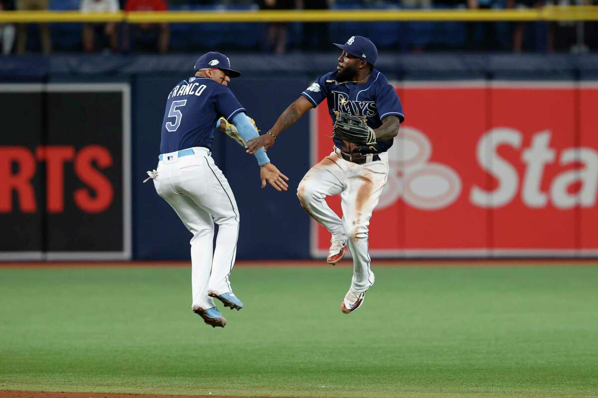 Tampa Bay Rays' Wander Franco, left, and Randy Arozarena celebrate after the Rays defeated the Boston Red Sox in a baseball game Tuesday, April 11, 2023, in St. Petersburg, Fla.
