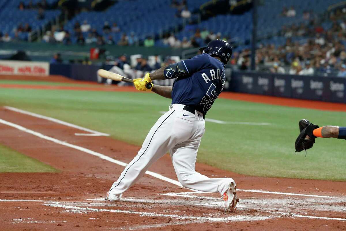 Tampa Bay Rays' Randy Arozarena hits an RBI-triple against the Houston Astros during the first inning of a baseball game Monday, April 24, 2023, in St. Petersburg, Fla.