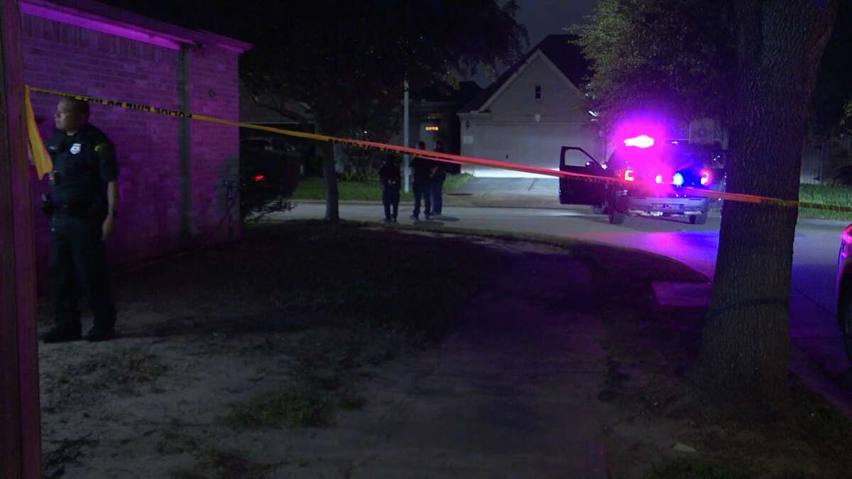 Police investigate the scene of a shooting in north Houston