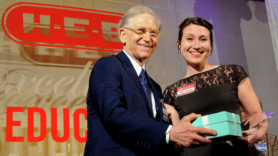 Mary Lagleder from Earl Warren High School is awarded the Rising Star award by Charles Butt at the HEB Excellence in Education Awards dinner at the Royal Sonesta Hotel Saturday May 03, 2014. 