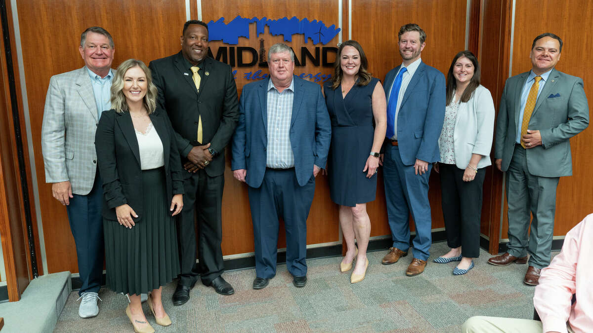 Robert Patrick, fourth from the left, stands with Mayor Lori Blong (to his left) and the rest of the Midland City Council during the meeting Tuesday at City Hall. 