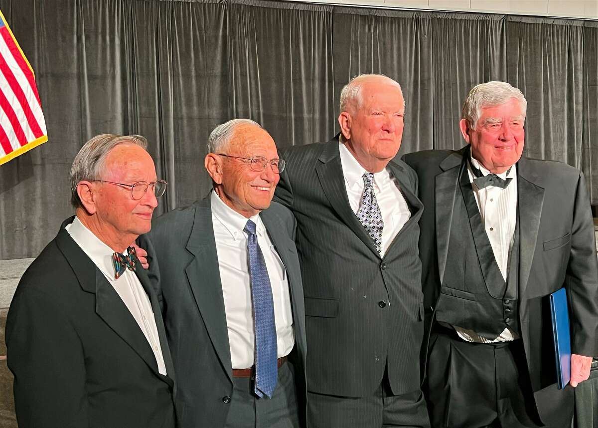 Dr. Glenn Rogers, representing the late F. Marie Hall and fellow honorees Ken Nolen, Ed Runyan and Don Sparks.