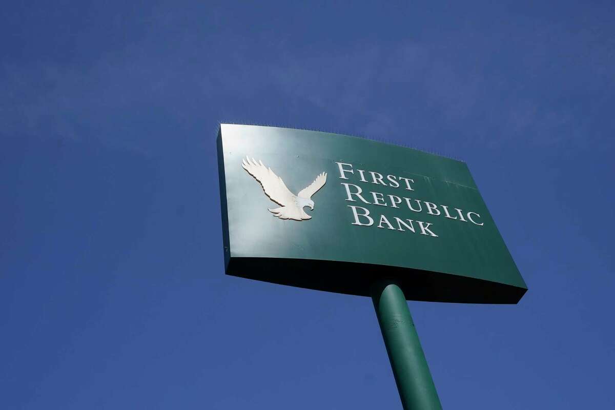 A sign to a First Republic Bank location is shown in San Francisco, Tuesday, April 25, 2023. First Republic Bank’s stock plunged Tuesday after it said depositors withdrew more than $100 billion during last month’s crisis, with fears swirling that it could be the third bank to fail after the collapse of Silicon Valley Bank and Signature Bank.