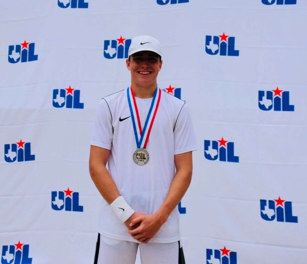 Grady junior Chapman Sims wears his silver medal after finishing second in boys singles during the UIL Class 1A Tennis State Tournament, April 26 in San ANtonio. 