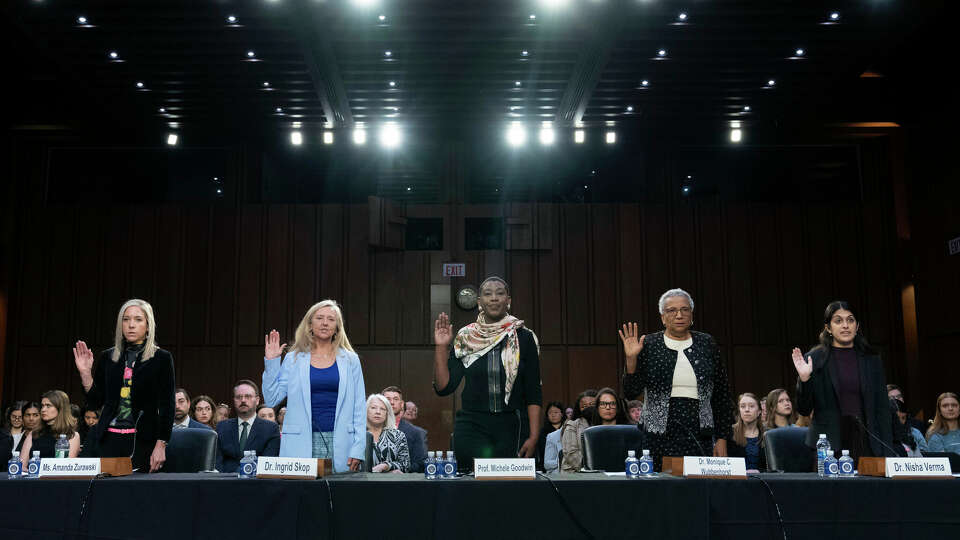 From left, Amanda Zurawski, Dr. Ingrid Skop, University of California law professor Michele Goodwin, Senior Research Associate de Nicola Center for Ethics and Culture University of Notre Dame Monique Wubbenhorst and Dr. Nisha Verma are sworn-in to testify at the Senate Judiciary Committee hearing on 'The Assault on Reproductive Rights in a Post-Dobbs America' on Capitol Hill in Washington, Wednesday, April 26, 2023. (AP Photo/Jose Luis Magana)