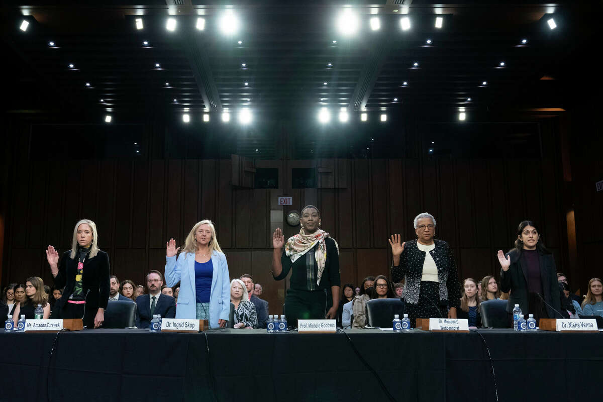 From left, Amanda Zurawski, Dr. Ingrid Skop, University of California law professor Michele Goodwin, Senior Research Associate de Nicola Center for Ethics and Culture University of Notre Dame Monique Wubbenhorst and Dr. Nisha Verma are sworn-in to testify at the Senate Judiciary Committee hearing on 'The Assault on Reproductive Rights in a Post-Dobbs America' on Capitol Hill in Washington, Wednesday, April 26, 2023. (AP Photo/Jose Luis Magana)