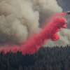 A firefighting air tanker releases fire retardant while battling the Mosquito Fire in unincorporated Placer County, Calif. Thursday, Sept. 8, 2022.